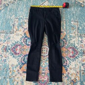 Women’s distressed skinny black jeans
